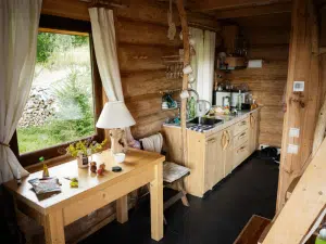Kitchen area of a charming cabin in East Tennessee, featuring natural wood cabinetry and a rustic design for a mountain home.